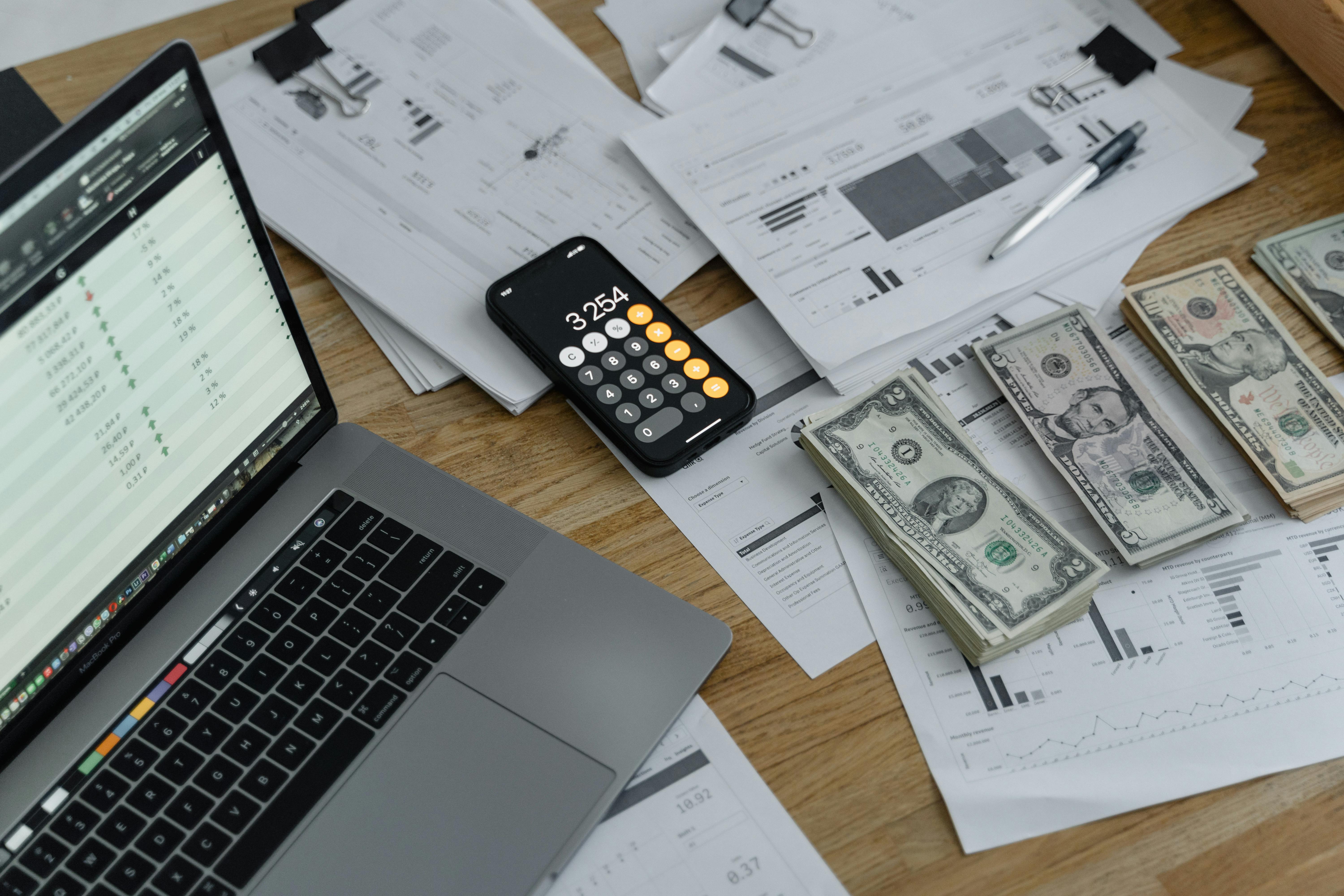 An illustration of manual payroll outsourcing without software. A stack of documents, calculators, and spreadsheets symbolizes traditional payroll processing. A professional is shown reviewing papers, representing the manual effort required for calculations and compliance without digital tools.